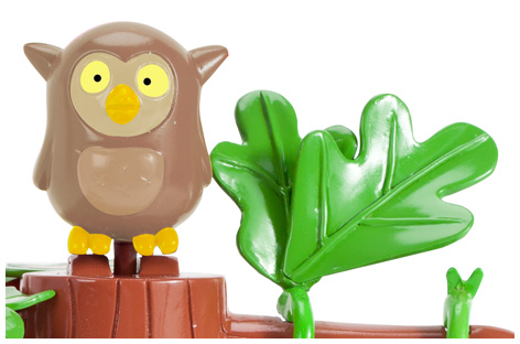 Close up of the Ben and Holly Swing and Slide Playset with the owl on top of the tree