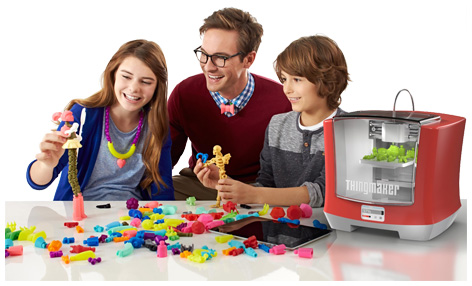 Family playing with Mattel's 3D ThingMaker Printer