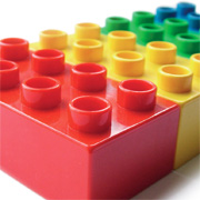 Boy playing with Lego construction toys