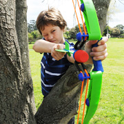 Boy taking aim with his Z-Curve Launcher from Wind Designs