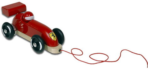 A pull-along wooden toy Ferrari