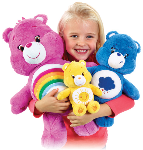 Girl with her favourite Care Bears