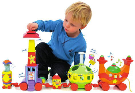 Boy playing with his Ninky Nonk Train and Track Set