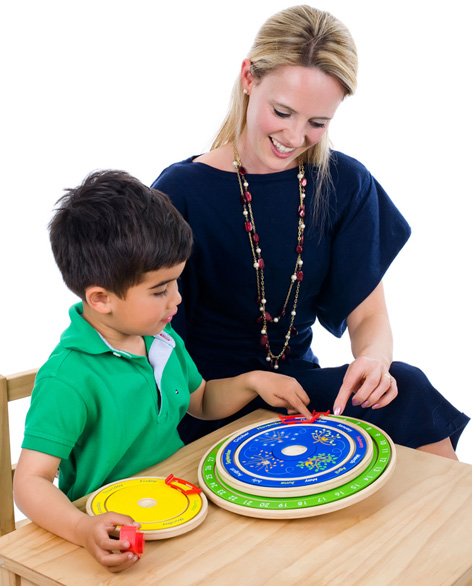 Boy playing with his Circa Calendar toy