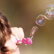 A boy blowing bubbles